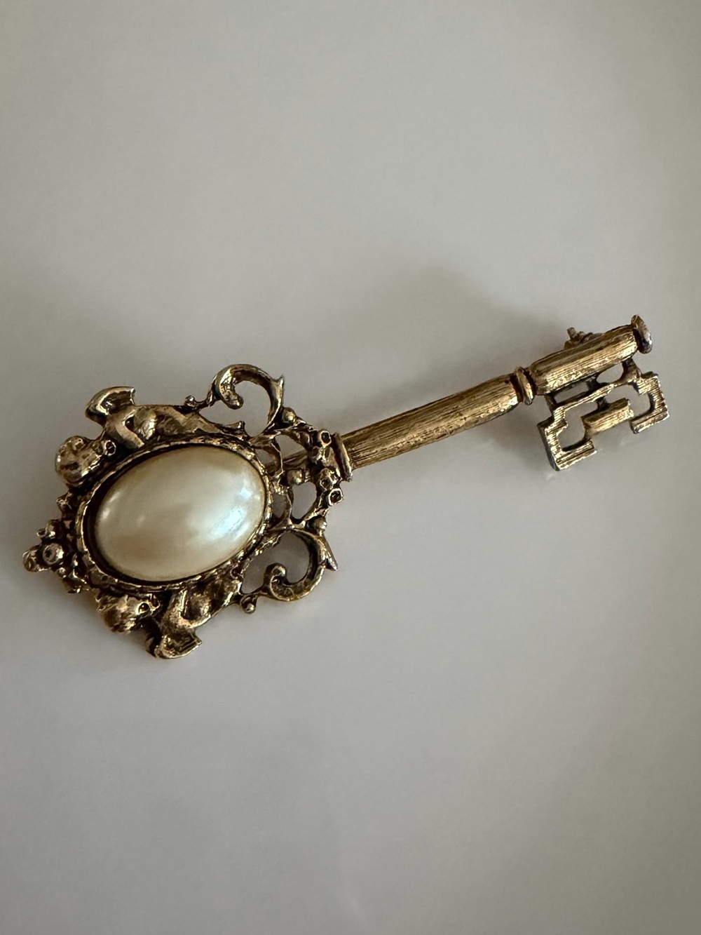 Gold-Tone Key Brooch with Oval faux Pearl Accent